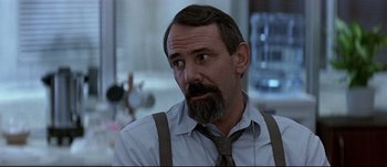 Movie still from “Patriot Games” (1992), directed by Phillip Noyce – A person wearing a tie; Close Up shot, Low angle