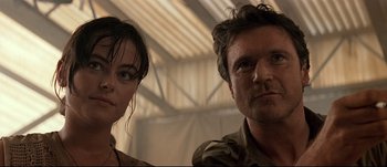 Movie still from “Patriot Games” (1992), directed by Phillip Noyce – A man and a woman standing next to each other; Close Up shot, Low angle