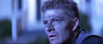 Movie still from “Patriot Games” (1992), directed by Phillip Noyce – A man's face in the dark; Close Up shot, Low angle