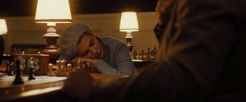 Movie still from “Pawn Sacrifice” (2014), directed by Edward Zwick – A young boy sitting at a table with a chess board; Close Up shot, High angle