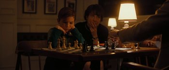 Movie still from “Pawn Sacrifice” (2014), directed by Edward Zwick – Two people sitting at a table playing a game of chess; Medium shot, High angle