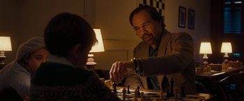 Movie still from “Pawn Sacrifice” (2014), directed by Edward Zwick – A man and a boy playing a game of chess; Close Up shot, Over the shoulder angle