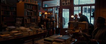 Movie still from “Pawn Sacrifice” (2014), directed by Edward Zwick – A man standing in front of a book store; Wide shot, Over the shoulder angle
