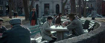Movie still from “Pawn Sacrifice” (2014), directed by Edward Zwick – A group of people sitting at a table playing chess; Wide shot, Over the shoulder angle