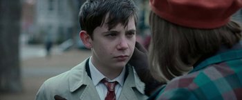 Movie still from “Pawn Sacrifice” (2014), directed by Edward Zwick – A young boy wearing a suit and a tie; Close Up shot, Over the shoulder angle