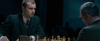 Movie still from “Pawn Sacrifice” (2014), directed by Edward Zwick – A man sitting at a table with a chess set; Close Up shot, High angle