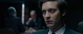 Movie still from “Pawn Sacrifice” (2014), directed by Edward Zwick – A person wearing a suit and tie; Close Up shot, Over the shoulder angle