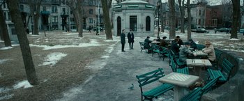 Movie still from “Pawn Sacrifice” (2014), directed by Edward Zwick – A group of people sitting on benches in a park; Extreme Wide shot, High angle
