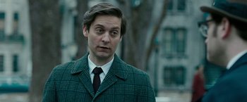 Movie still from “Pawn Sacrifice” (2014), directed by Edward Zwick – A person wearing a suit and tie; Close Up shot, Over the shoulder angle