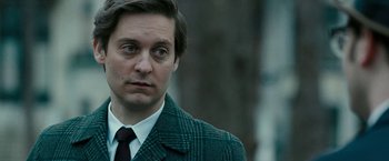 Movie still from “Pawn Sacrifice” (2014), directed by Edward Zwick – A person wearing a suit and tie; Close Up shot, Over the shoulder angle