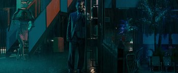 Movie still from “Pawn Sacrifice” (2014), directed by Edward Zwick – A man in a suit talking on a phone; Wide shot, Low angle