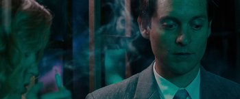 Movie still from “Pawn Sacrifice” (2014), directed by Edward Zwick – A person wearing a suit smoking a cigarette; Close Up shot, Low angle