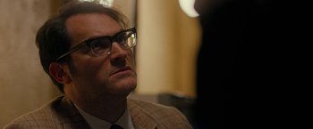 Movie still from “Pawn Sacrifice” (2014), directed by Edward Zwick – A person wearing a suit and glasses; Close Up shot, Over the shoulder angle