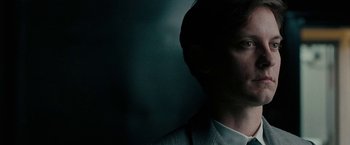 Movie still from “Pawn Sacrifice” (2014), directed by Edward Zwick – A person wearing a suit and tie; Close Up shot, Low angle