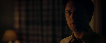 Movie still from “Pawn Sacrifice” (2014), directed by Edward Zwick – A man in a white shirt is looking at the camera; Close Up shot, Low angle