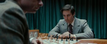 Movie still from “Pawn Sacrifice” (2014), directed by Edward Zwick – Two men are playing a game of chess; Close Up shot, Over the shoulder angle