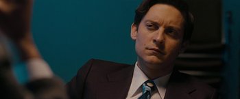 Movie still from “Pawn Sacrifice” (2014), directed by Edward Zwick – A person wearing a suit and tie; Close Up shot, Low angle