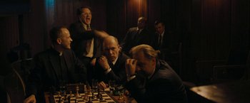 Movie still from “Pawn Sacrifice” (2014), directed by Edward Zwick – A group of men sitting at a table playing chess; Medium shot, Over the shoulder angle