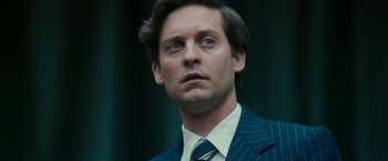Movie still from “Pawn Sacrifice” (2014), directed by Edward Zwick – A person wearing a suit and tie; Close Up shot, Low angle