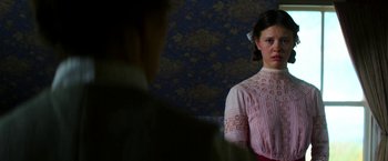 Movie still from “Pearl” (2022), directed by Ti West – A woman in a pink dress looking at a man in a white shirt; Close Up shot, Over the shoulder angle