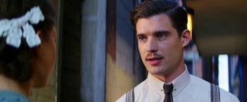 Movie still from “Pearl” (2022), directed by Ti West – A man with a mustache wearing a tie; Close Up shot, Over the shoulder angle