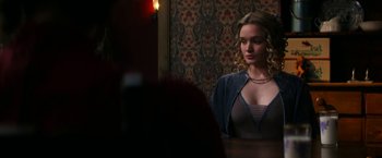 Movie still from “Pearl” (2022), directed by Ti West – A beautiful young woman standing in front of a mirror; Medium shot, Over the shoulder angle