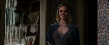 Movie still from “Pearl” (2022), directed by Ti West – A woman with blonde hair and a blue dress; Medium shot, Over the shoulder angle