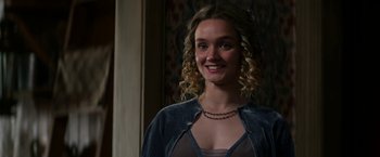 Movie still from “Pearl” (2022), directed by Ti West – A beautiful young lady with curly blonde hair; Close Up shot, Over the shoulder angle