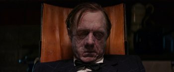 Movie still from “Pearl” (2022), directed by Ti West – A person wearing a suit and bow tie; Close Up shot, High angle