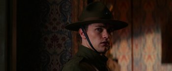 Movie still from “Pearl” (2022), directed by Ti West – A man wearing a hat and a uniform; Close Up shot, Low angle