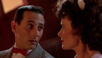 Movie still from “Pee-wee's Big Adventure” (1985), directed by Tim Burton – A man and a woman talking to each other; Close Up shot, Over the shoulder angle