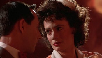 Movie still from “Pee-wee's Big Adventure” (1985), directed by Tim Burton – A man and a woman looking at one another; Close Up shot, Over the shoulder angle