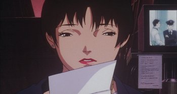 Movie still from “Perfect Blue” (1997), directed by Kô Matsuo – A person holding a piece of paper; Close Up shot, Low angle