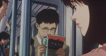 Movie still from “Perfect Blue” (1997), directed by Kô Matsuo – A man and a woman looking at each other in a train; Close Up shot, High angle