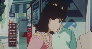 Movie still from “Perfect Blue” (1997), directed by Kô Matsuo – A girl with a cat ears on her head is walking; Close Up shot, Over the shoulder angle