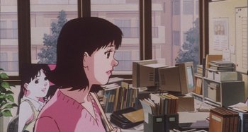 Movie still from “Perfect Blue” (1997), directed by Kô Matsuo – A woman sitting in front of a computer desk; Medium shot, High angle