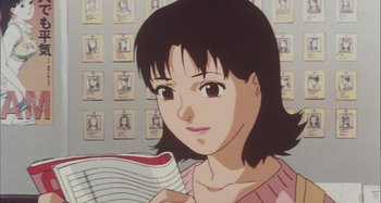 Movie still from “Perfect Blue” (1997), directed by Kô Matsuo – A person holding a book; Close Up shot, High angle