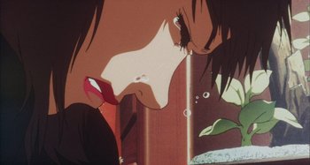 Movie still from “Perfect Blue” (1997), directed by Kô Matsuo – View of a woman's face and lips; Extreme Close Up shot, Low angle
