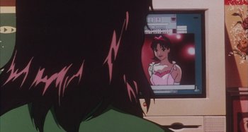 Movie still from “Perfect Blue” (1997), directed by Kô Matsuo – A woman looking into a computer screen; Extreme Close Up shot, Over the shoulder angle