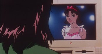 Movie still from “Perfect Blue” (1997), directed by Kô Matsuo – A woman looking into a computer screen with an image on it; Close Up shot, Over the shoulder angle