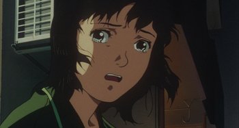 Movie still from “Perfect Blue” (1997), directed by Kô Matsuo – An animated woman looking surprised at the camera; Close Up shot, Low angle
