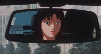 Movie still from “Perfect Blue” (1997), directed by Kô Matsuo – A woman's reflection in the rear view mirror of a car; Close Up shot, Over the shoulder angle