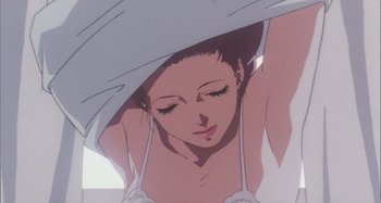 Movie still from “Perfect Blue” (1997), directed by Kô Matsuo – A woman is under a blanket in a room; Close Up shot, Low angle