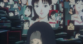 Movie still from “Perfect Blue” (1997), directed by Kô Matsuo – A woman's face in front of a wall of pictures; Extreme Close Up shot, High angle