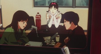 Movie still from “Perfect Blue” (1997), directed by Kô Matsuo – A group of people sitting around a table; Medium shot, High angle