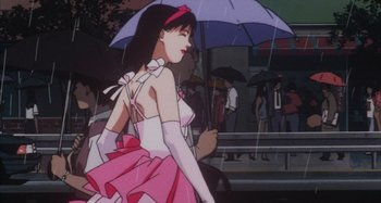 Movie still from “Perfect Blue” (1997), directed by Kô Matsuo – A woman in a pink dress holding an umbrella; Medium shot, Low angle