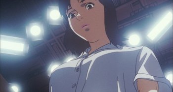 Movie still from “Perfect Blue” (1997), directed by Kô Matsuo – A person standing in front of lights and looking up; Close Up shot, Low angle