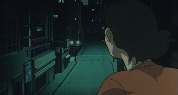 Movie still from “Perfect Blue” (1997), directed by Kô Matsuo – A man looking out a window at night in a city; Close Up shot, High angle
