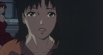 Movie still from “Perfect Blue” (1997), directed by Kô Matsuo – A woman's face in a dark room; Close Up shot, Low angle