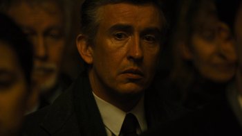 Movie still from “Philomena” (2013), directed by Stephen Frears – A person wearing a suit and tie; Close Up shot, Over the shoulder angle